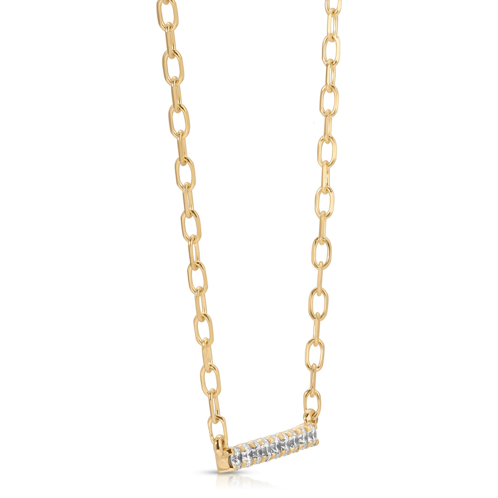 Gold chain necklace with a small diamond bar pendant on a white background