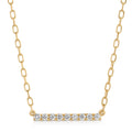 Gold necklace with a bar pendant featuring diamonds on a white background