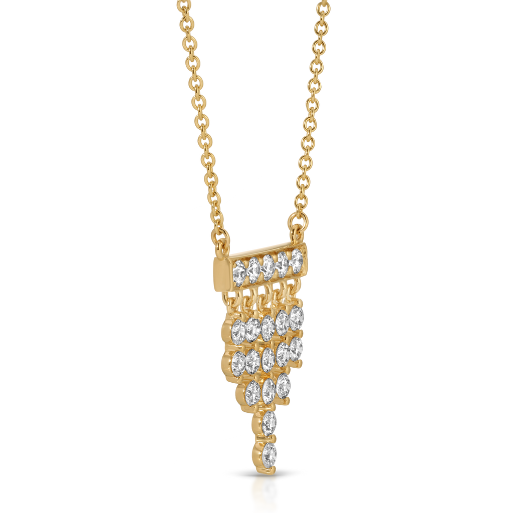 Gold necklace with a unique pendant design on a white background