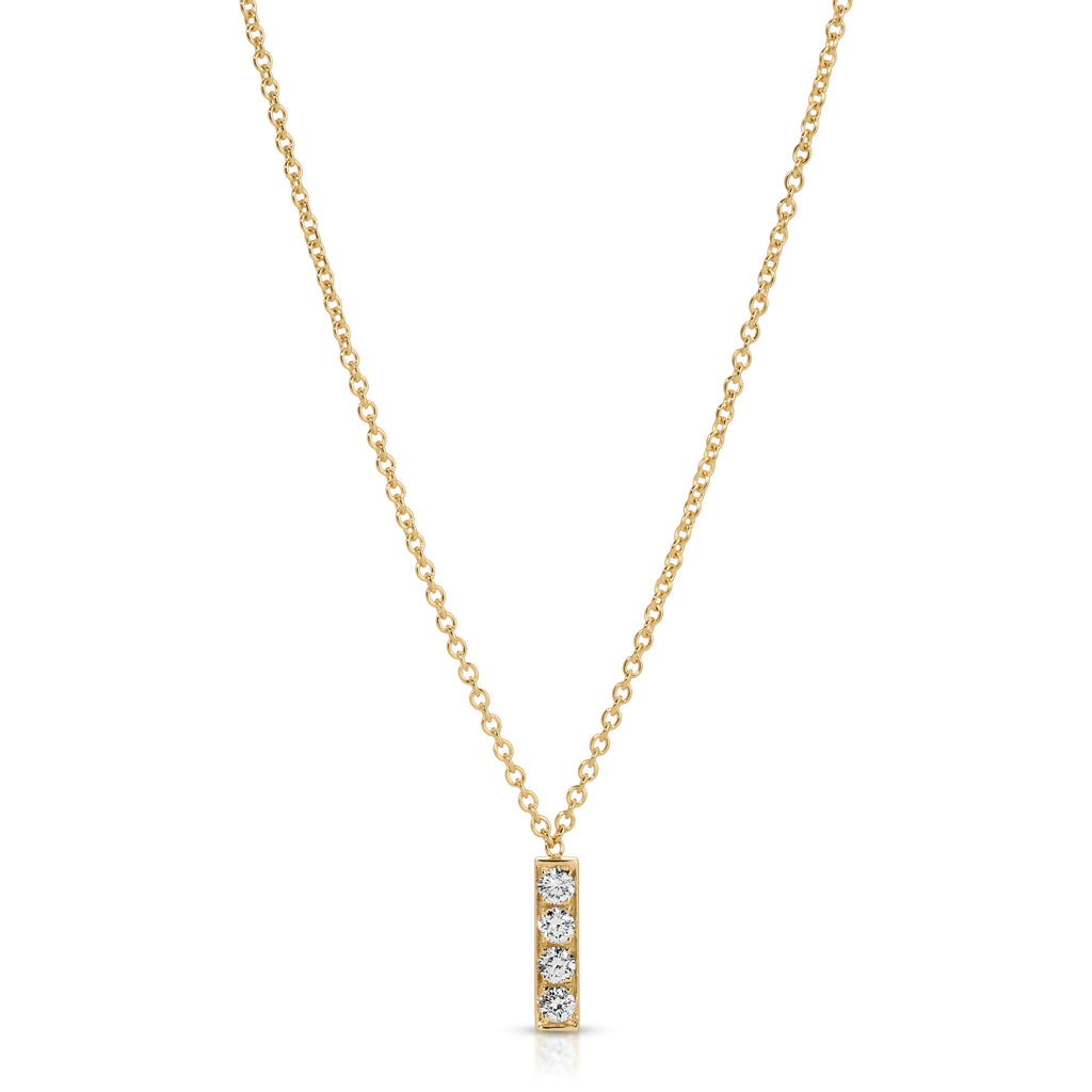 Gold necklace with a small pendant on a white background