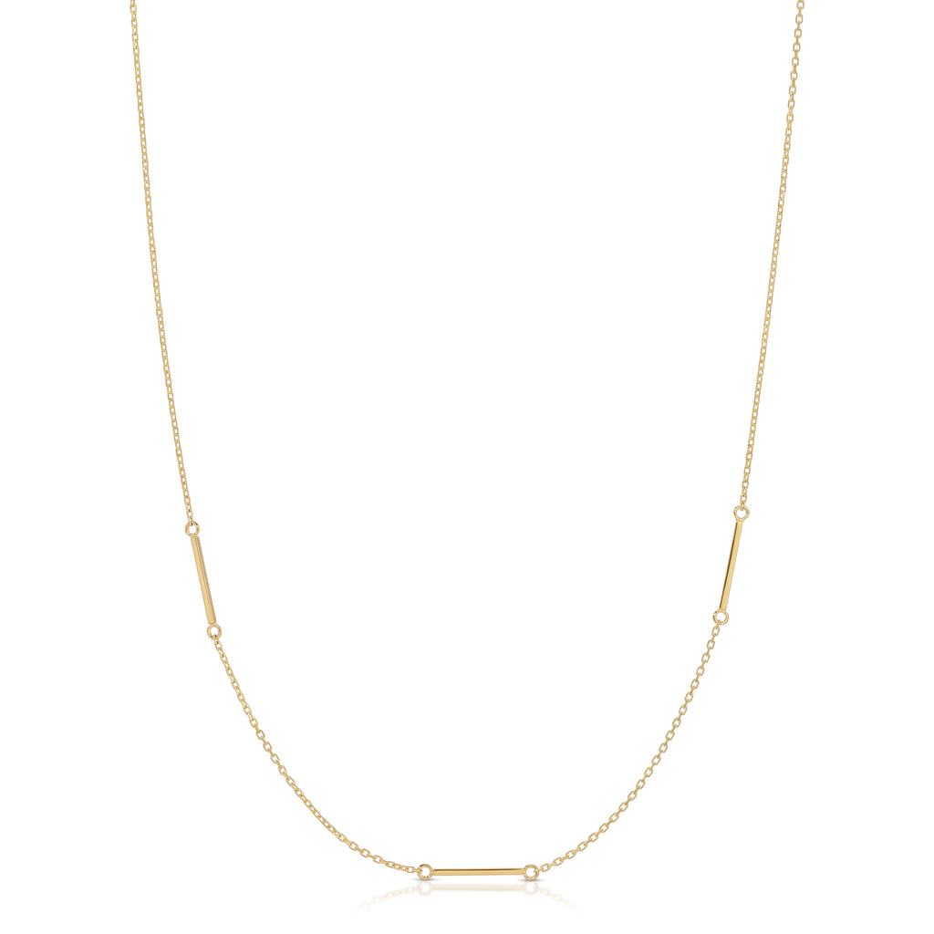 Gold necklace with a bar pendant on a white background