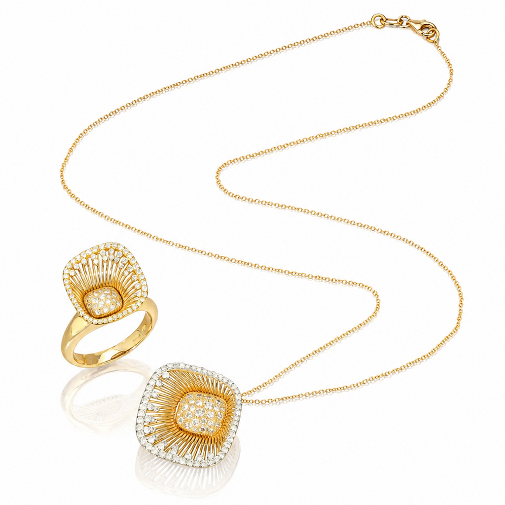 A gold jewelry set featuring a delicate chain necklace and a matching ring, both with square-shaped pendants adorned with pavé-set clear stones in a sunburst pattern.