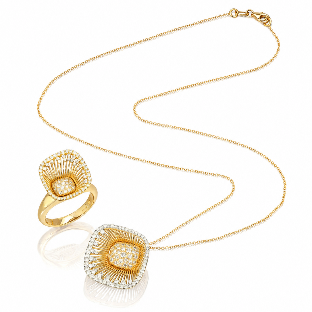 A gold jewelry set featuring a delicate chain necklace and a matching ring, both with square-shaped pendants adorned with pavé-set clear stones in a sunburst pattern.
