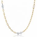 A delicate gold chain necklace featuring three small round-cut clear gemstones at the center, with additional clear stones set at intervals along the chain, displayed on a clean white background with a soft reflection below.