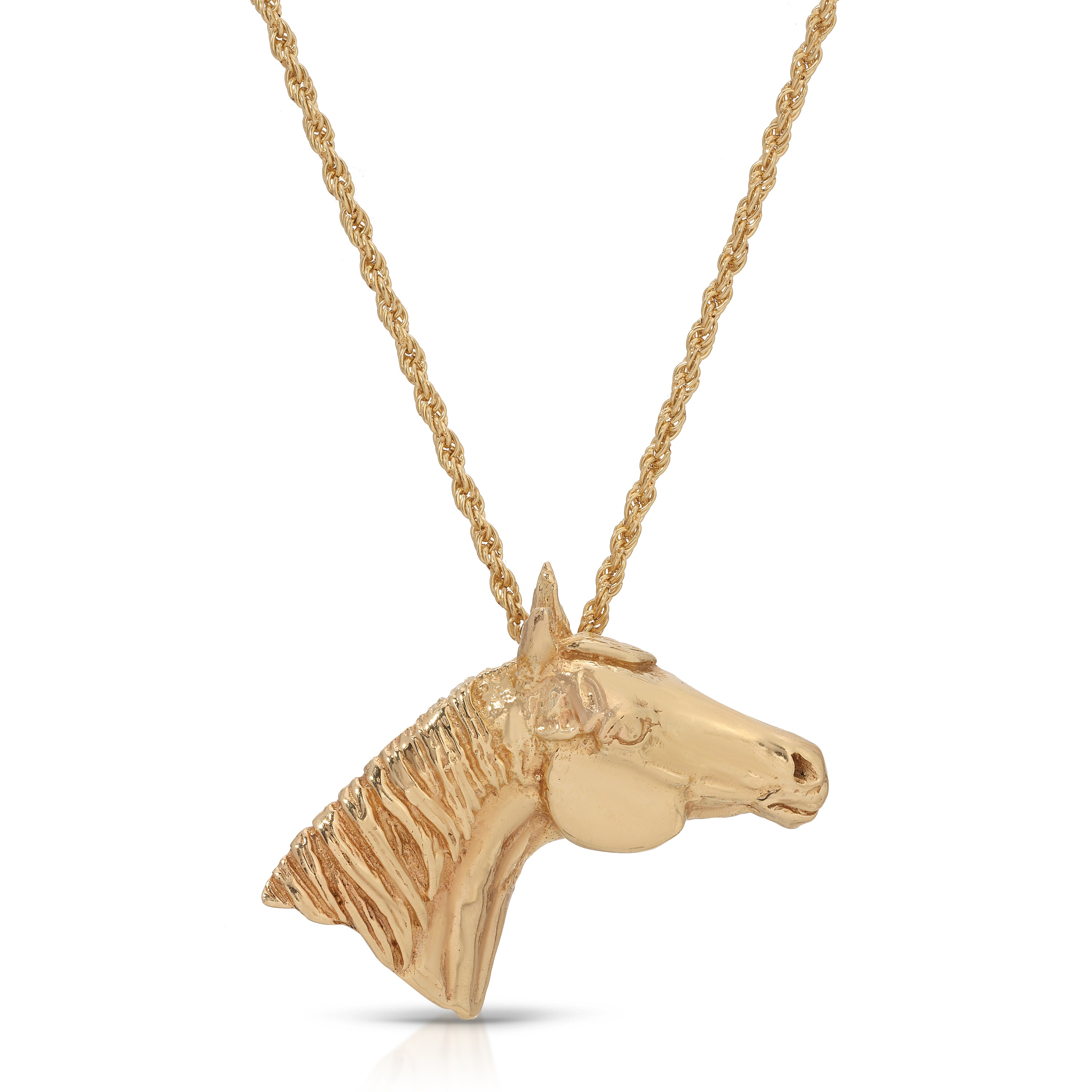 Gold horse head pendant on a chain against a white background