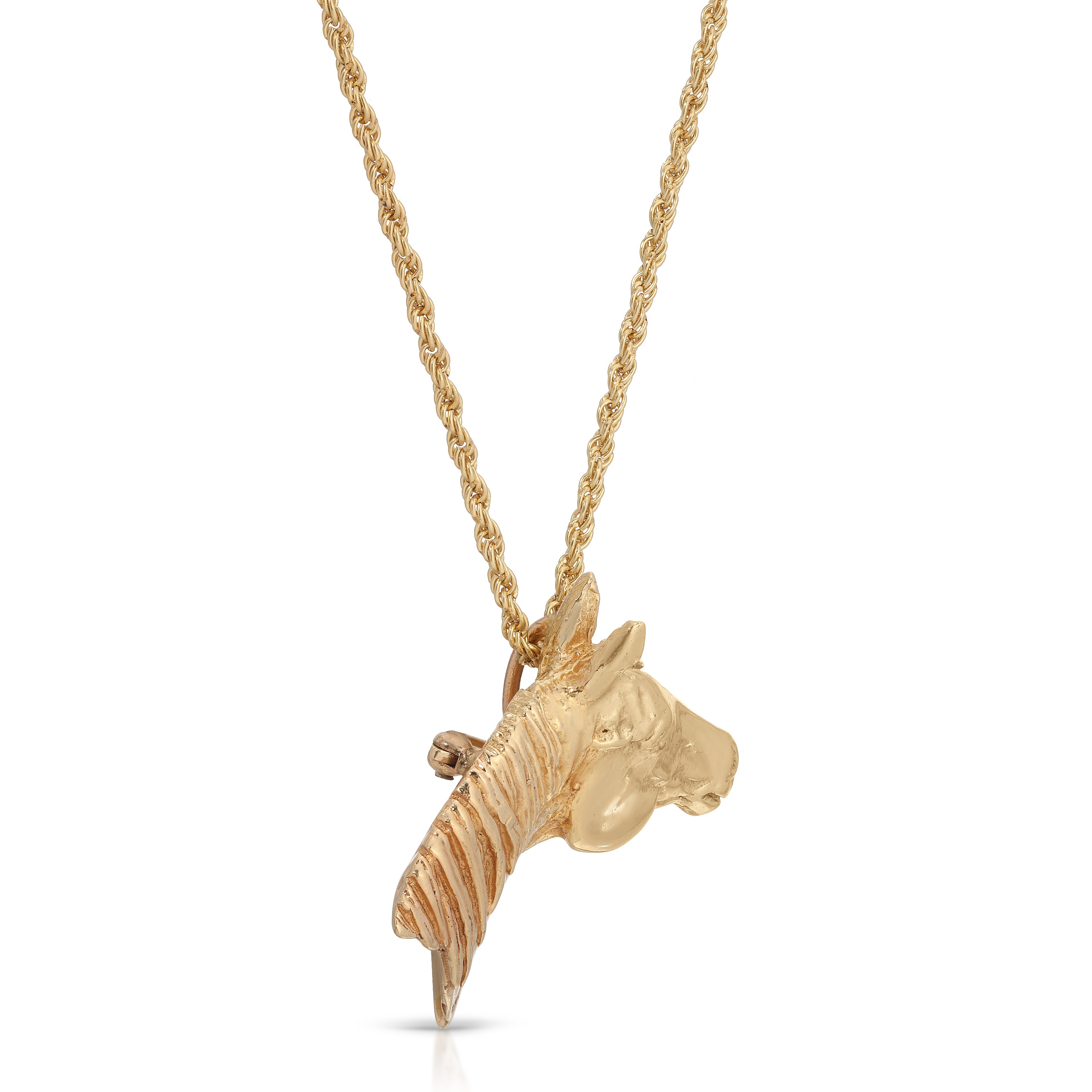 Gold horse head pendant on a chain against a white background