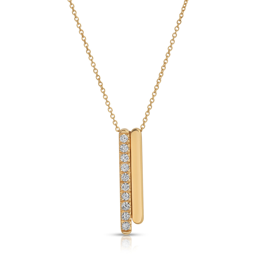 Gold necklace with a vertical bar pendant featuring diamonds on a white background