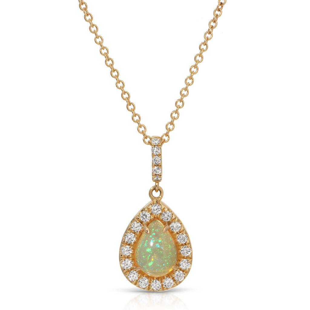 Gold necklace with a teardrop-shaped opal pendant on a white background