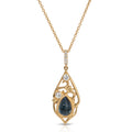 Gold necklace with a teardrop-shaped pendant featuring a blue gemstone and small diamonds on a white background.