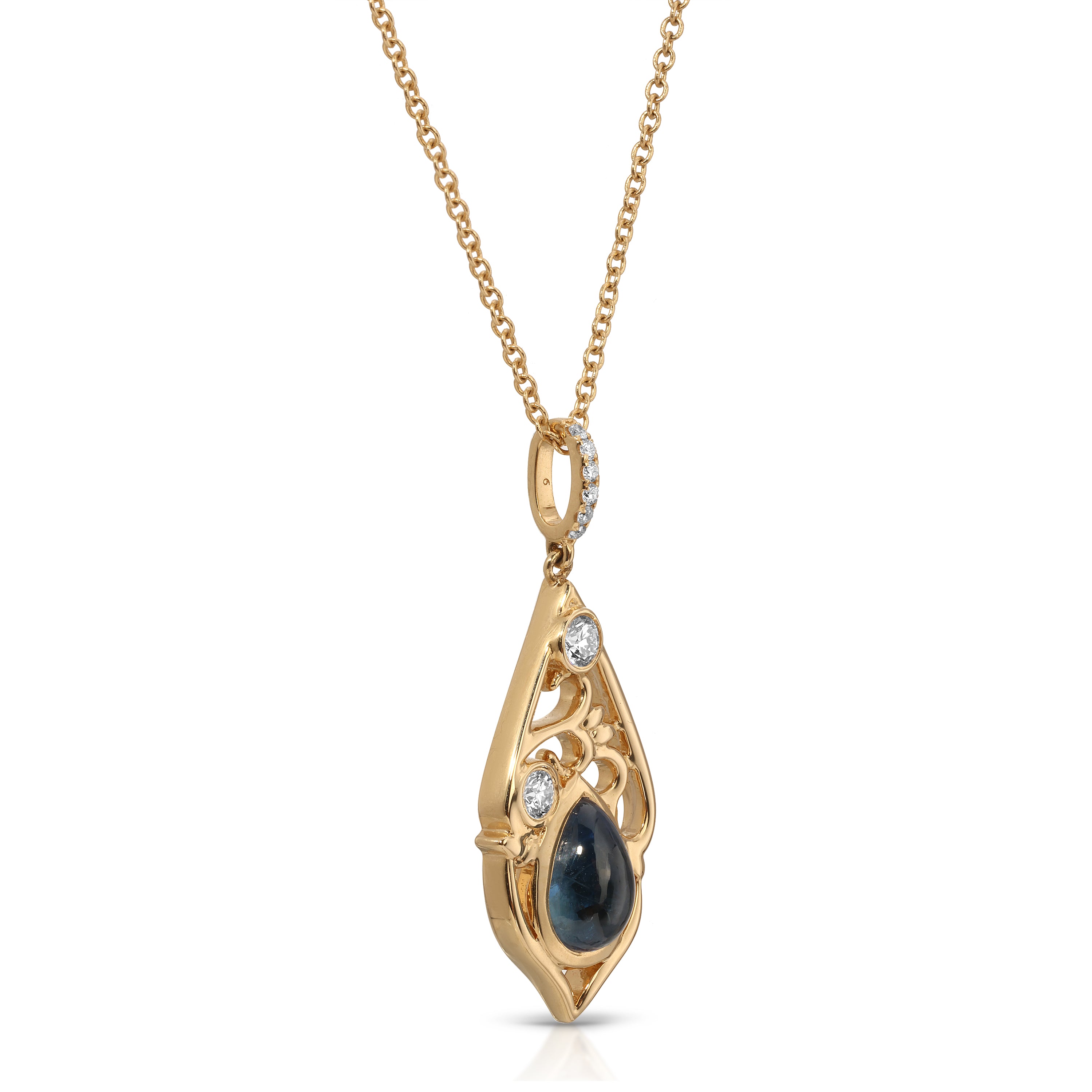 Gold pendant with a blue gemstone on a white background