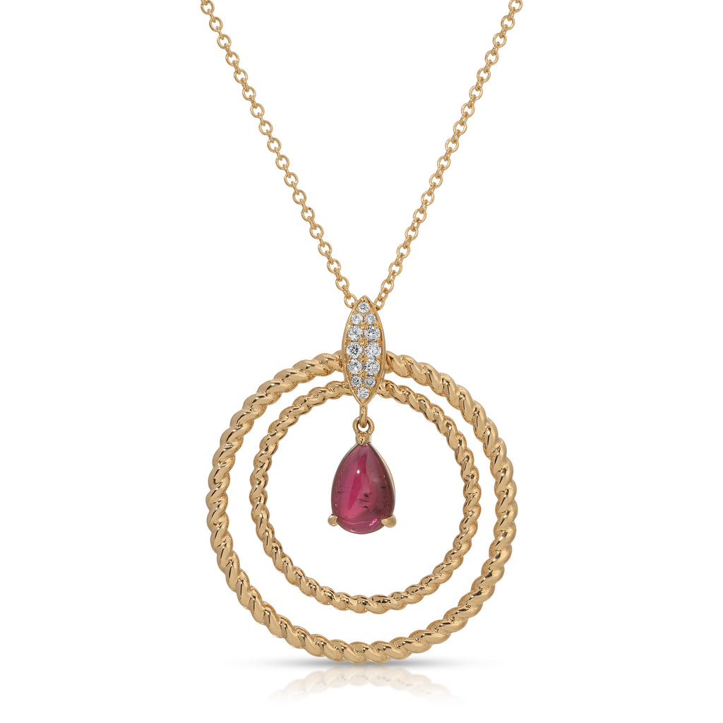Gold necklace with a red gemstone pendant on a white background