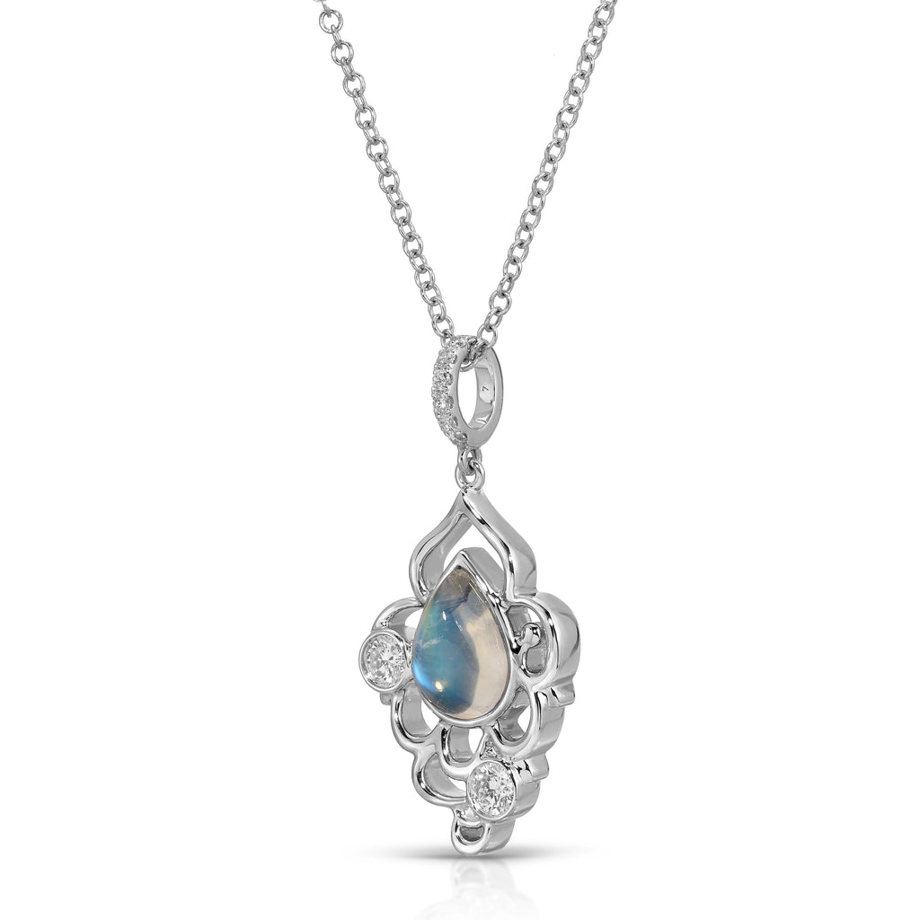 Silver pendant with a central gemstone on a white background