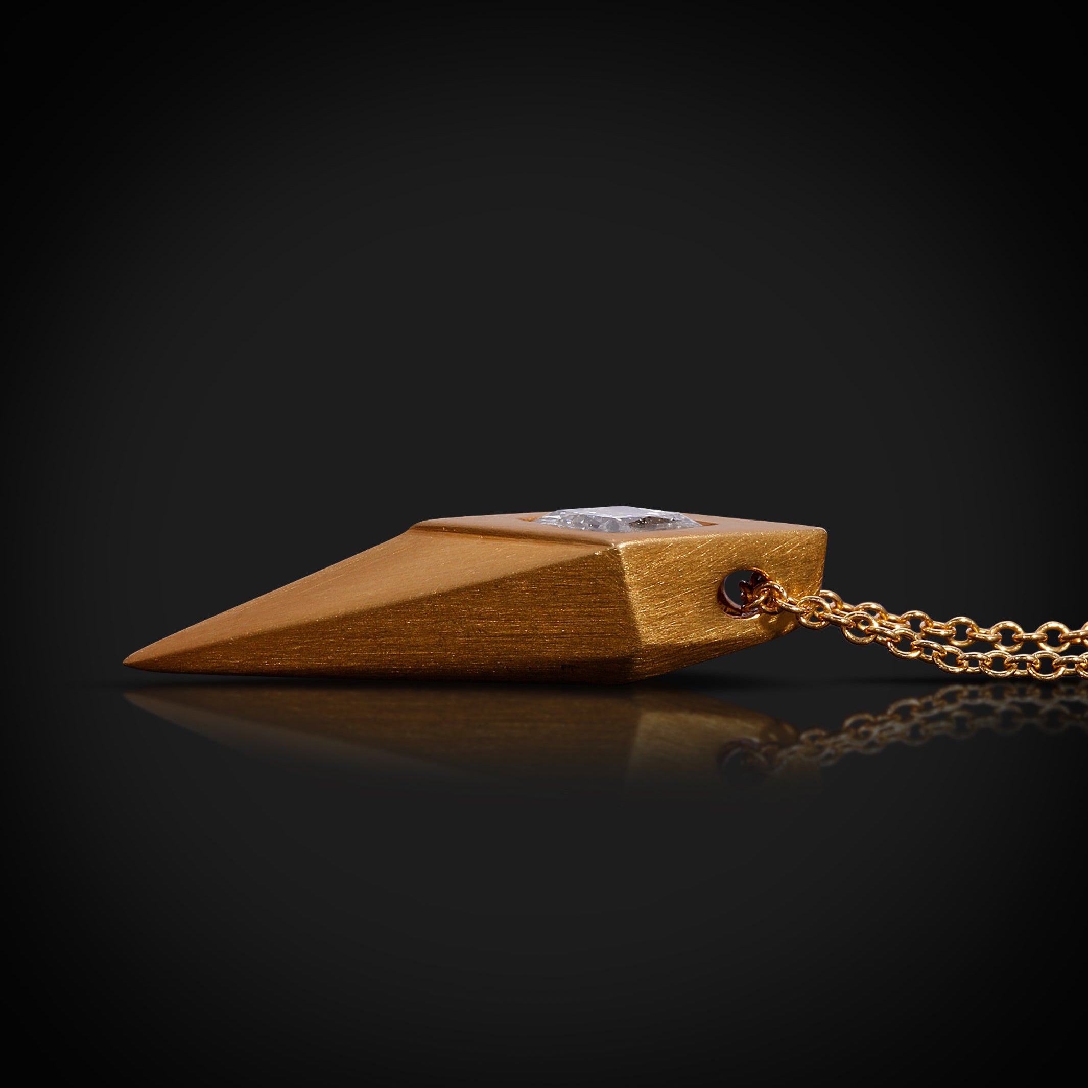 Wooden pendant with a chain on a black background