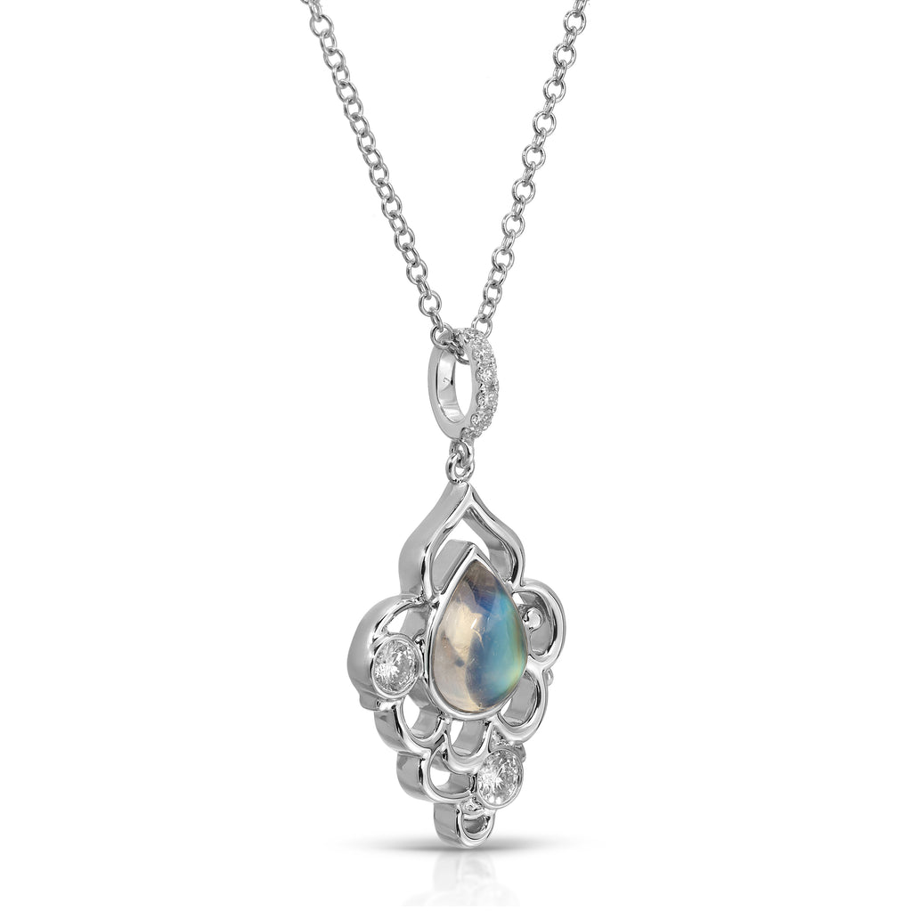 Silver pendant with a central gemstone on a white background