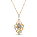 Gold necklace with a teardrop-shaped pendant on a white background
