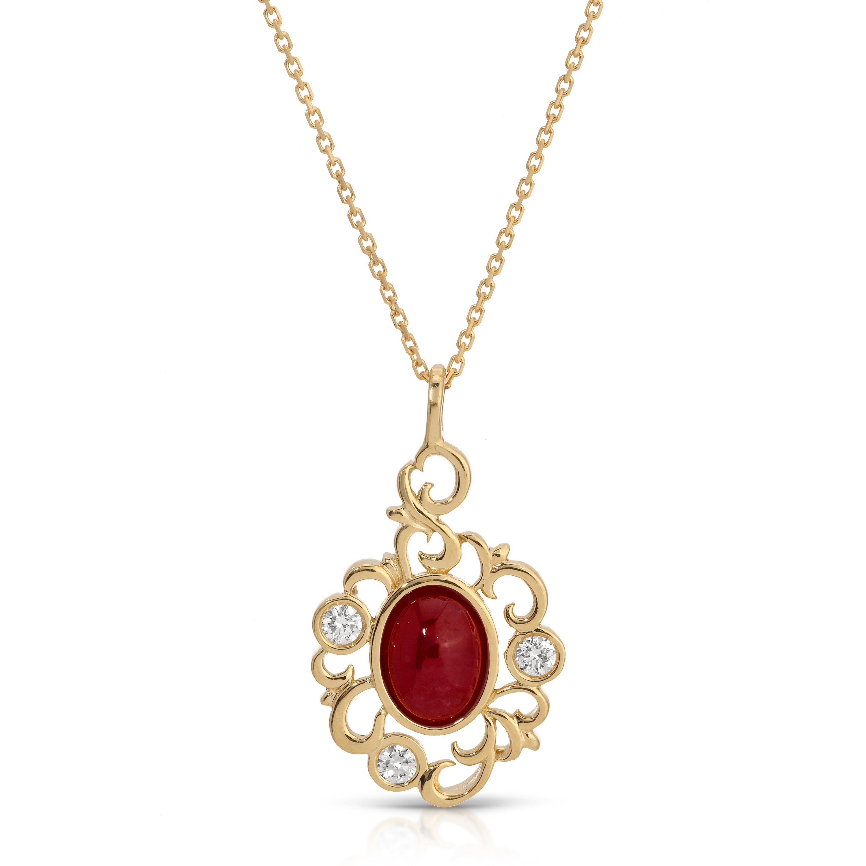 Gold necklace with a red gemstone pendant on a white background