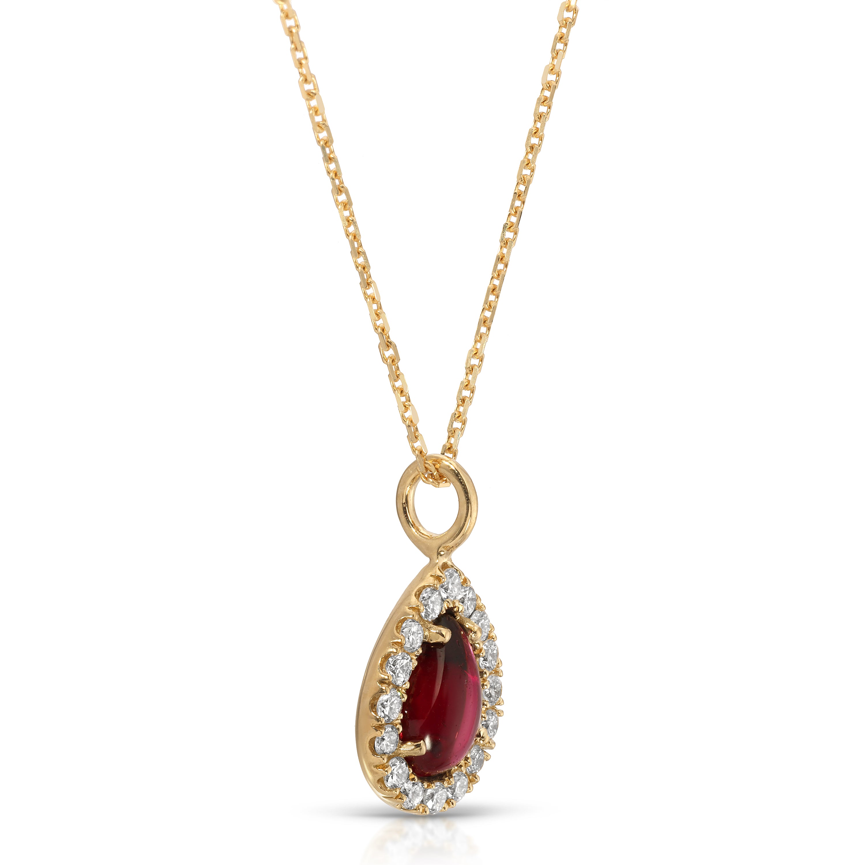 Gold necklace with a teardrop-shaped pendant featuring a red gemstone and clear stones on a white background.