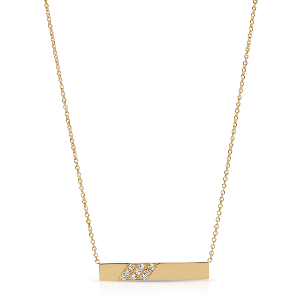 Gold necklace with a bar pendant on a white background