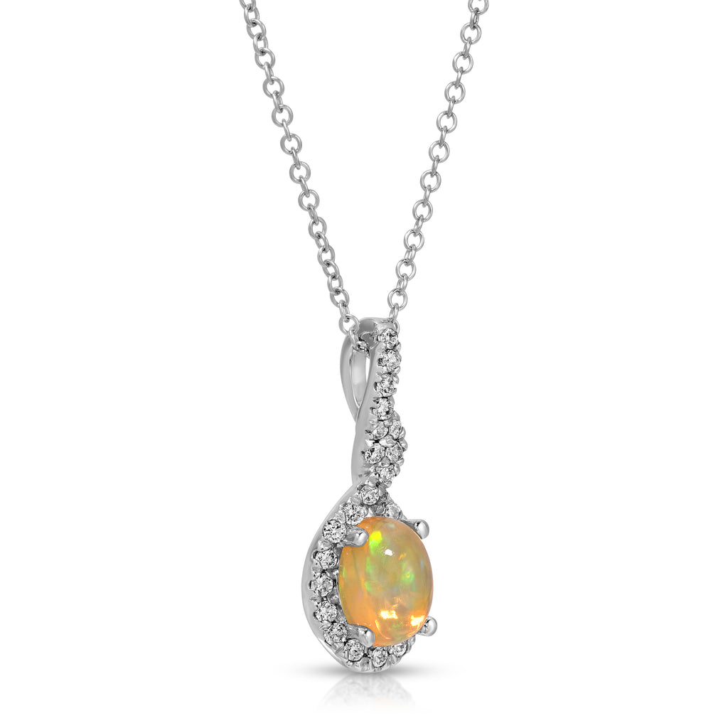 A silver pendant necklace featuring a teardrop-shaped opal gemstone with a warm orange and green play-of-color, surrounded by a halo of small clear stones, suspended from a delicate silver chain on a white background.
