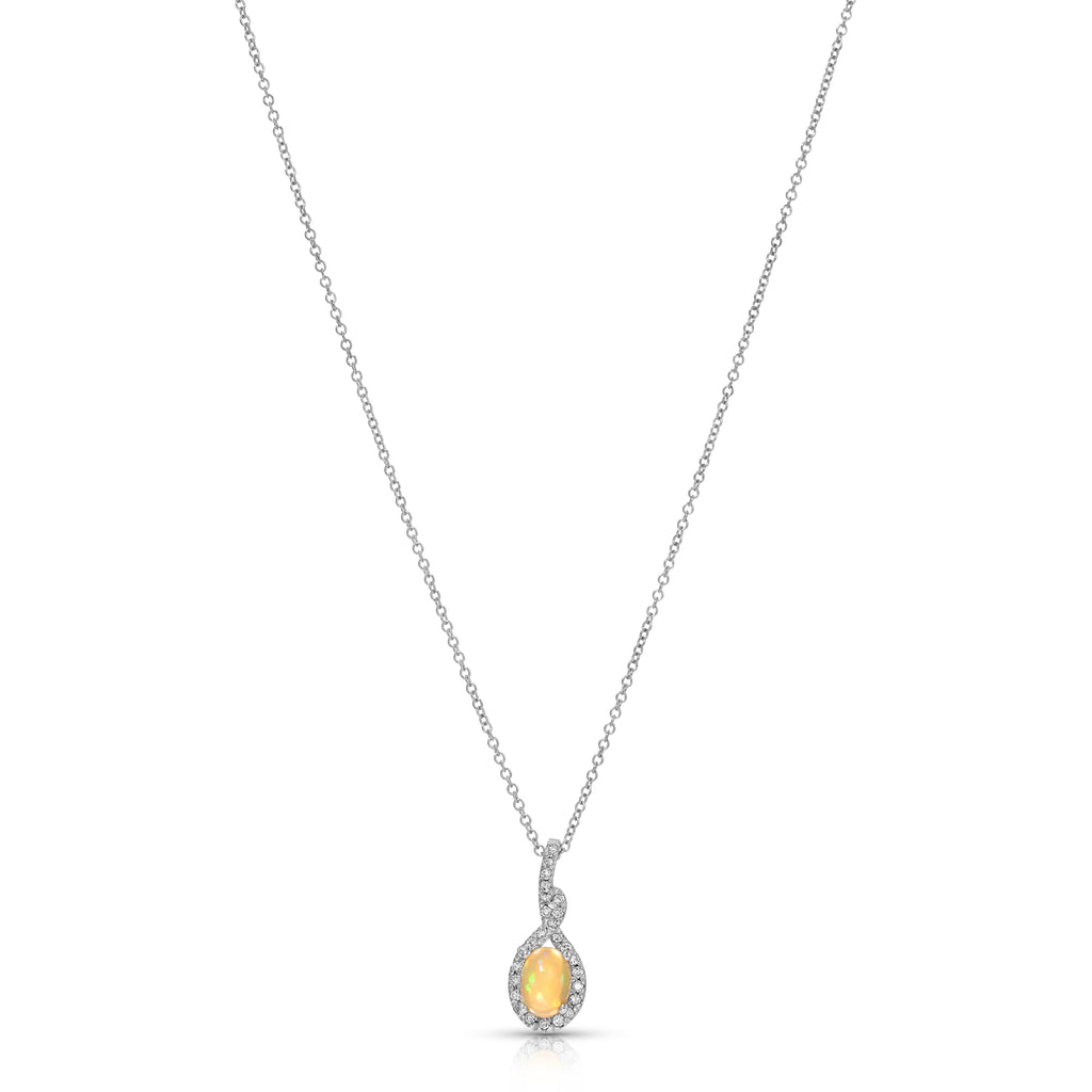 A silver-toned teardrop pendant necklace featuring a warm yellow gemstone surrounded by small clear stones, suspended on a delicate chain against a plain white background.