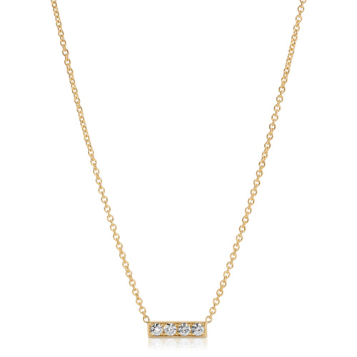 Gold necklace with a bar pendant featuring three diamonds on a white background